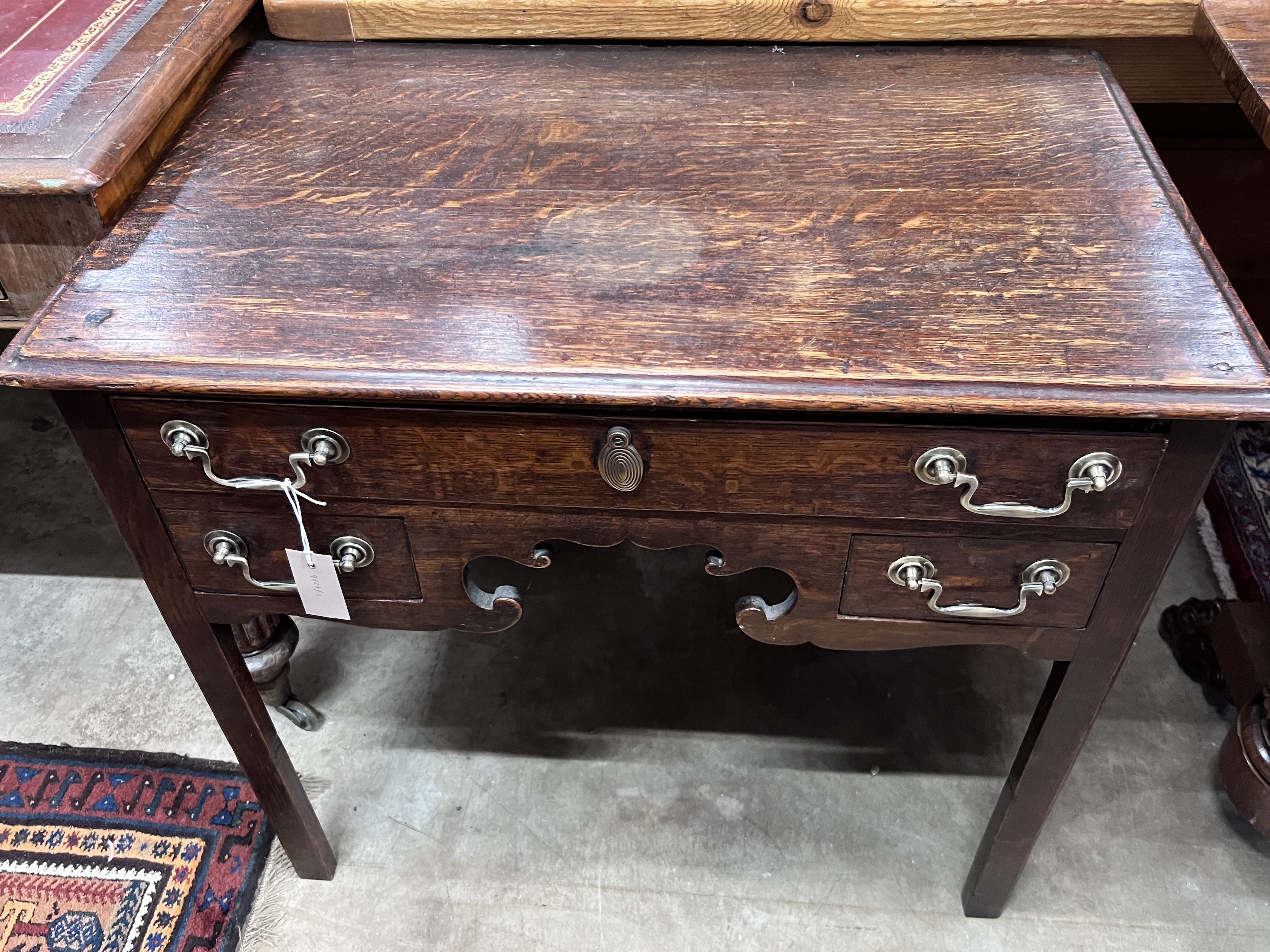 A George III oak lowboy, width 79cm, depth 48cm, height 72cm